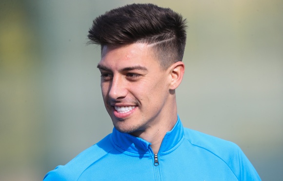 Emiliano Rigoni purchases food supplies for his home town
