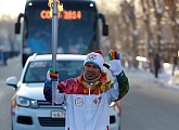 Konstantin Zyryanov carries Olympic torch through Perm
